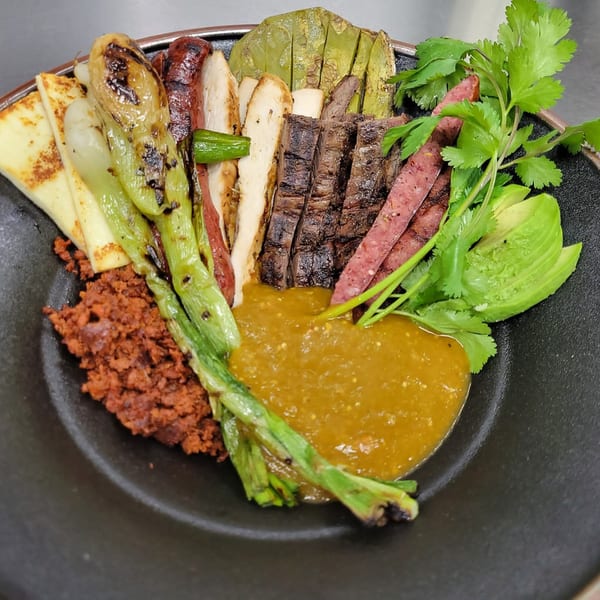 Mr. Sombrero's Mexican dish with grilled meats, peppers, cheese, nopales, chorizo, avocado, and salsa.