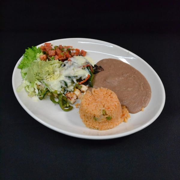 Mr. Sombrero's Mexican dish with chicken fajitas, rice, refried beans, guacamole, and pico de gallo.